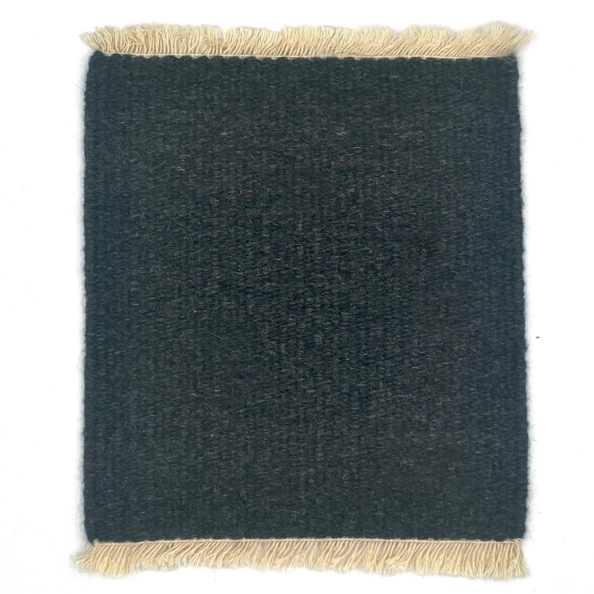 Dark gray rug with beige fringes on a white background