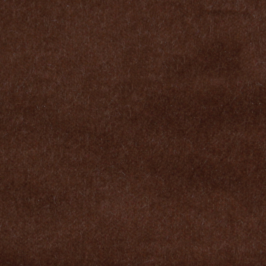 Detail of velvet fabric yardage in dark brown.