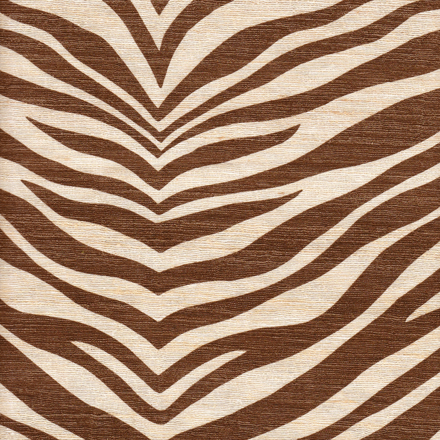 Detail of fabric in a zebra print in brown on a cream field.