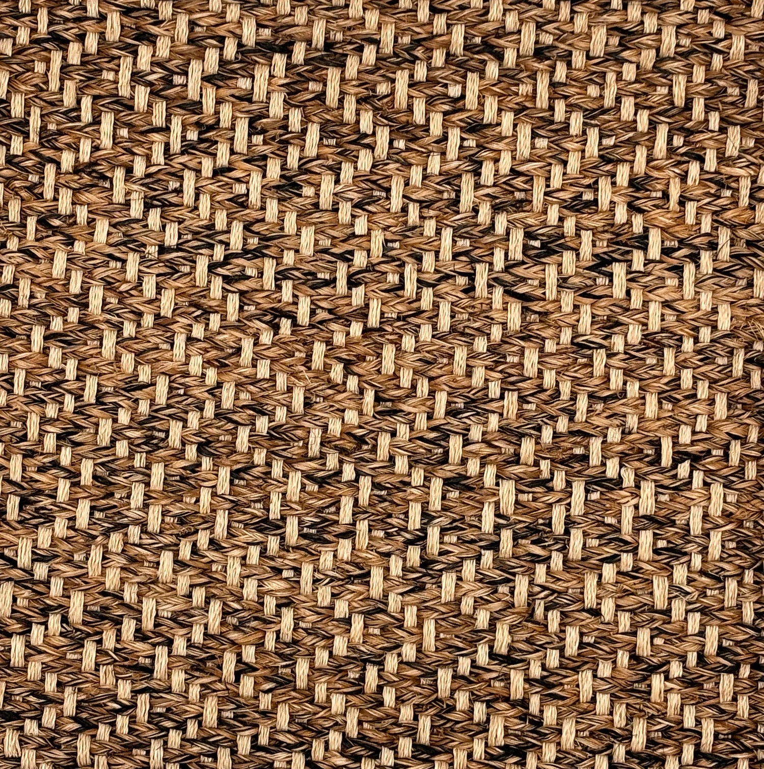 Handwoven rug sample in brown, tan and black abaca.