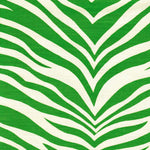 Detail of fabric in a zebra print in green on a white field.