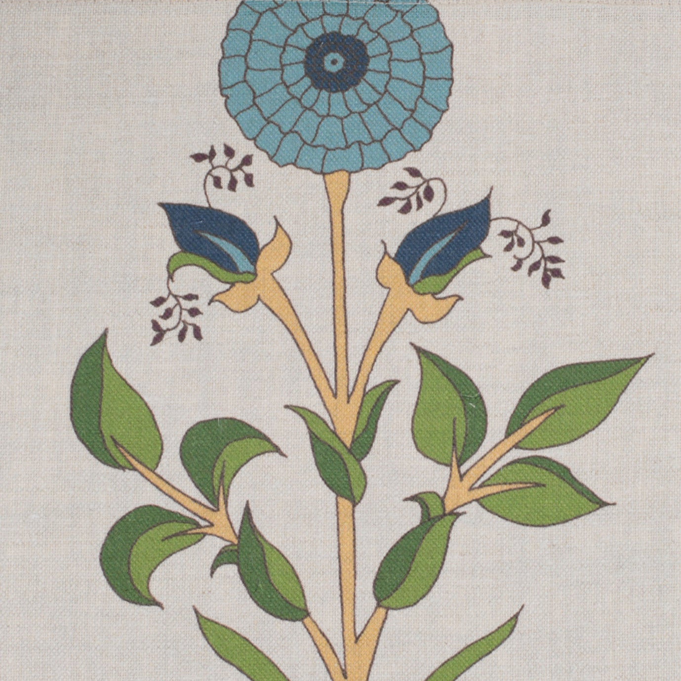 Detail of fabric in a large-scale marigold print in blue, orange and green on a cream field.