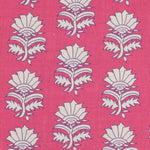 Detail of fabric in a repeating thistle print in cream and purple on a fuchsia field.