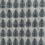 Detail of fabric woven in a repeating leaf print in shades of navy and gray.