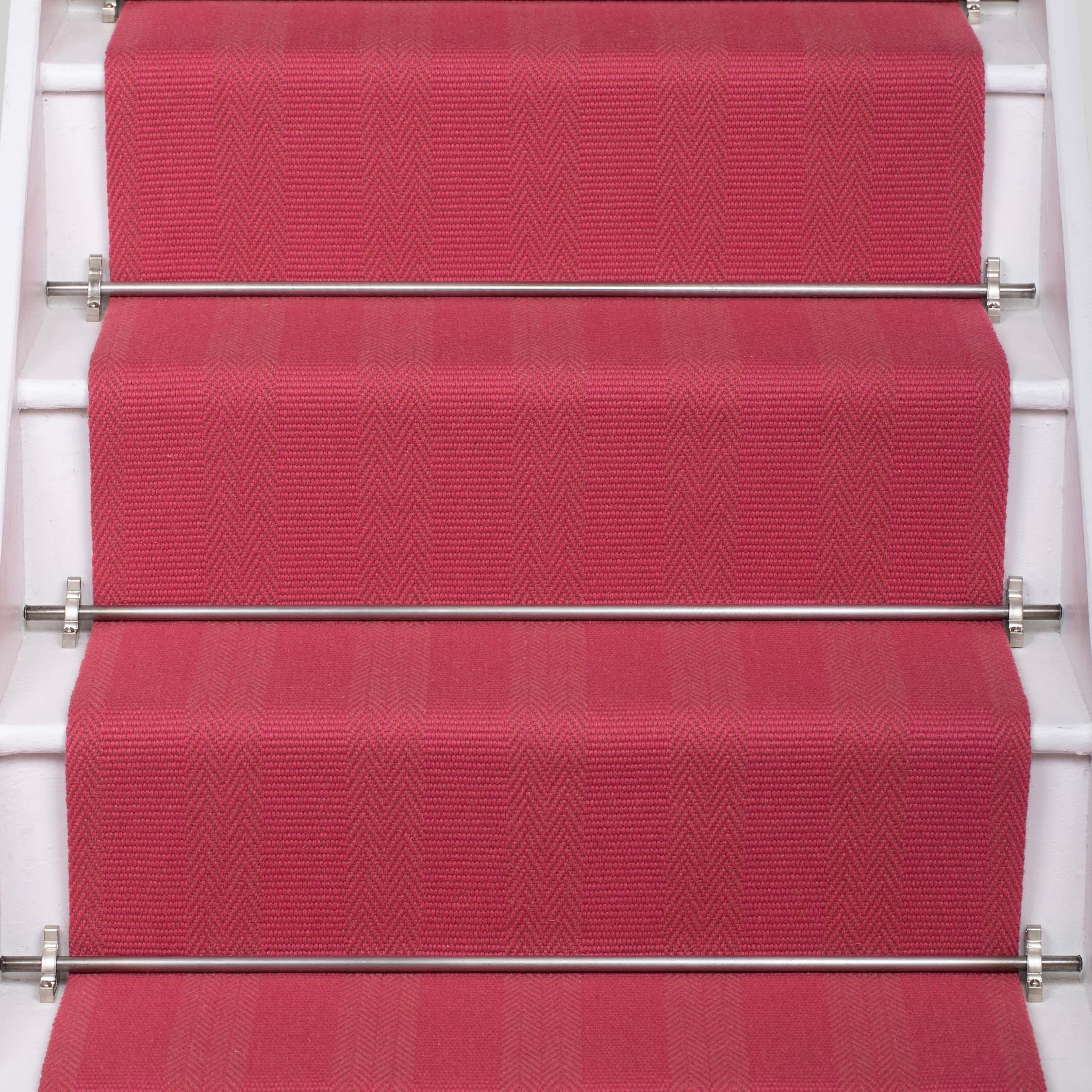 Striped flatweave runner in pink on white staircase