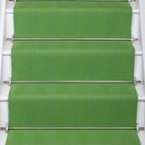 Striped flatweave runner in green on white staircase