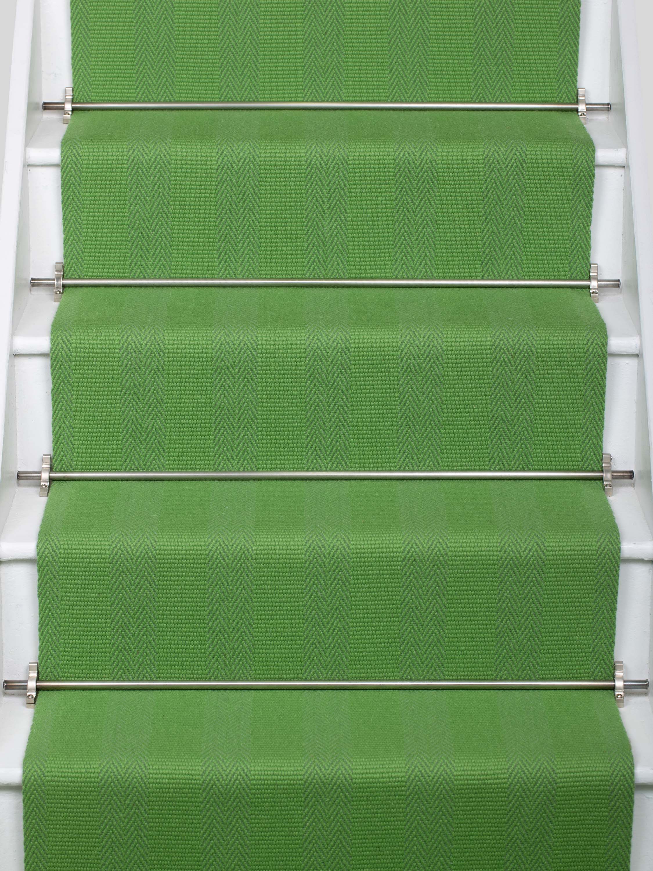 Striped flatweave runner in green on white staircase