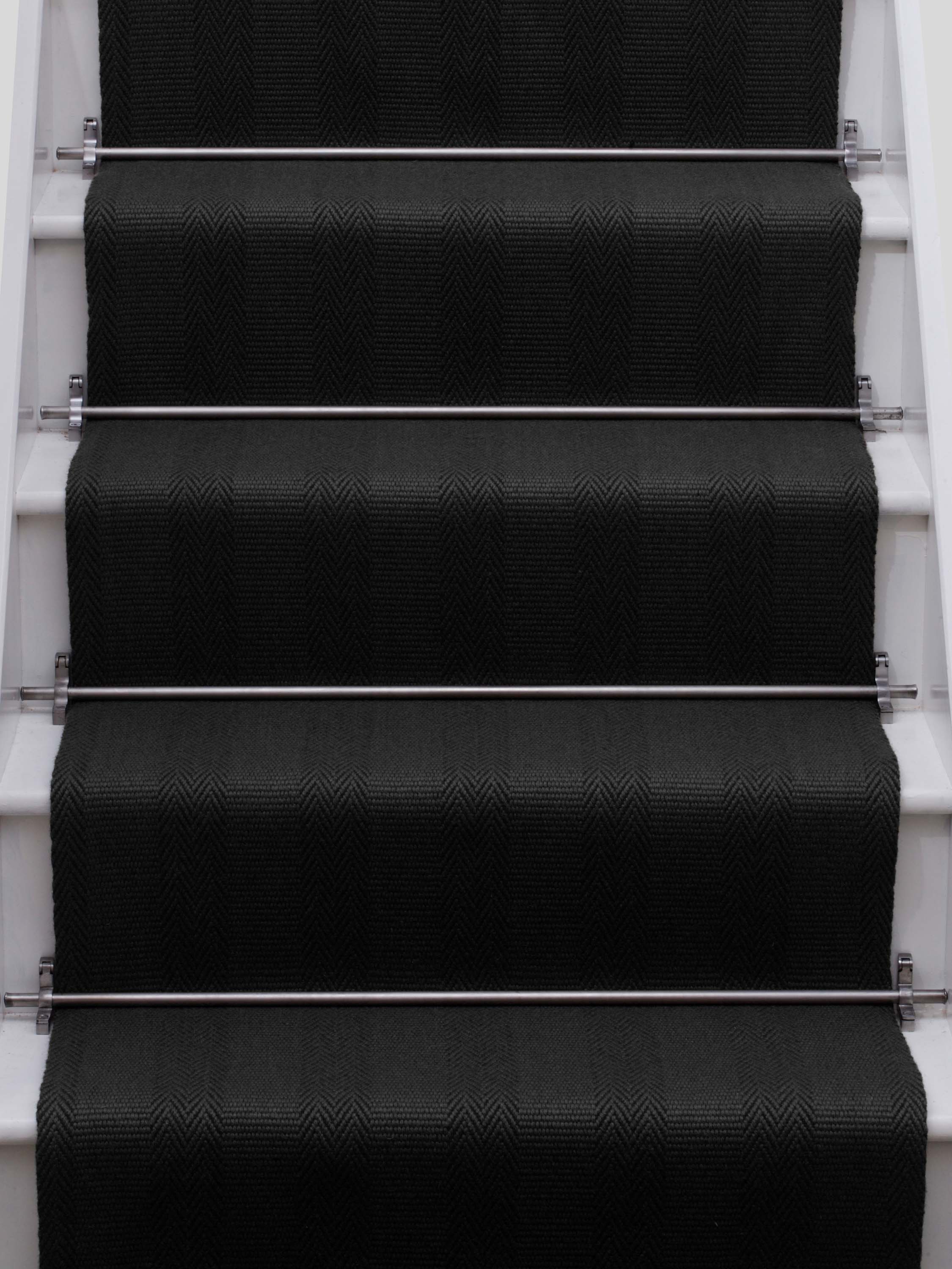 Striped flatweave runner in black on white staircase