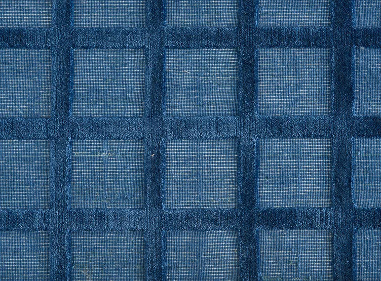 Broadloom carpet swatch in a checkered pattern in a blue design