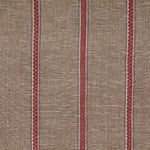 Detail of fabric in a chevron stripe print in brown and red with blue accents.