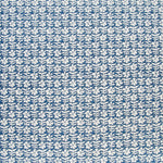 Detail of fabric in a floral grid print in white on a navy field.