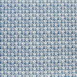 Detail of fabric in a floral grid print in white on a navy field.