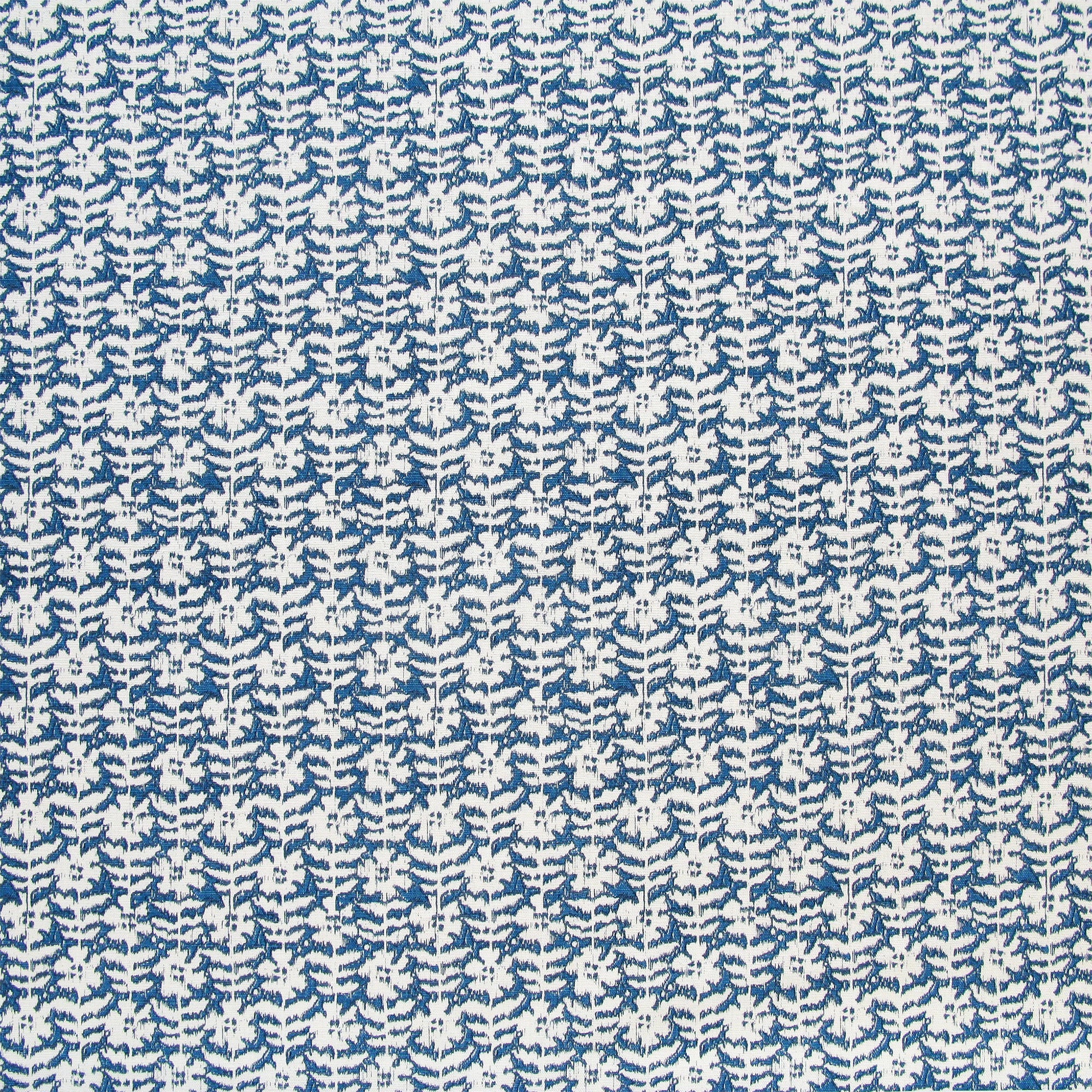 Detail of fabric in a floral grid print in white on a navy field.