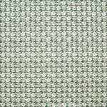 Detail of fabric in a floral grid print in white on a forest green field.