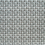 Detail of fabric in a floral grid print in white on a dark brown field.