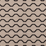 Patterned rug with black zigzag lines on a beige background