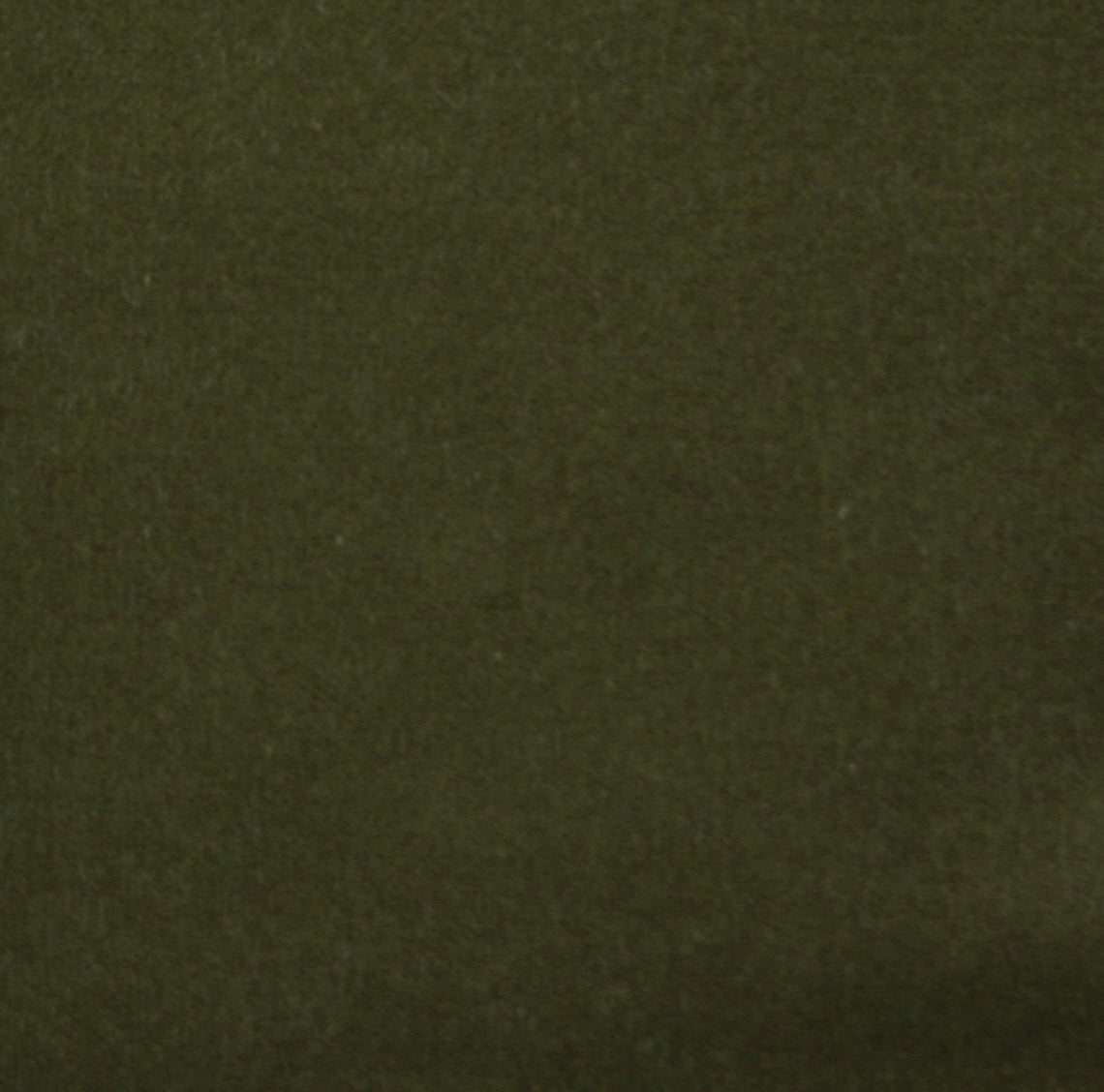 Detail of velvet fabric yardage in olive.