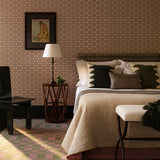 A bedroom fulled a star patterned wallpaper, checkerboard rug in a palatte of cream, black, green and lavender.