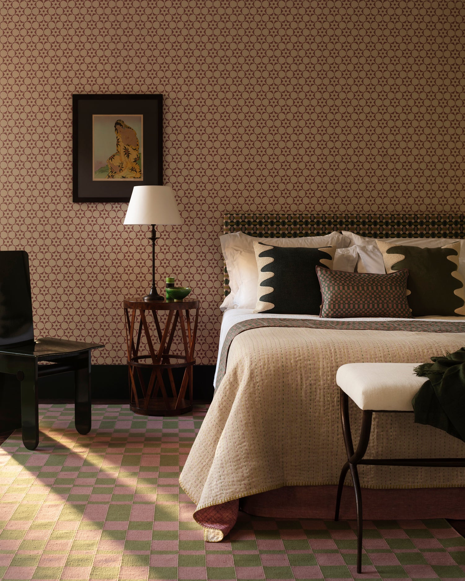 A bedroom fulled a star patterned wallpaper, checkerboard rug in a palatte of cream, black, green and lavender.