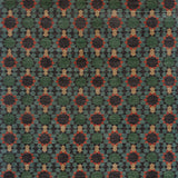 Patterned carpet with geometric design in green, red, and beige.