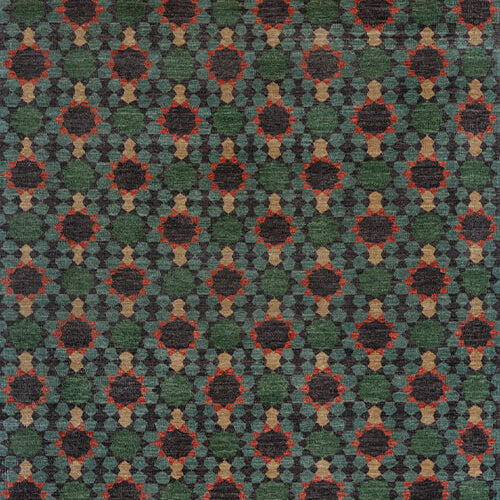 Patterned carpet with geometric design in green, red, and beige.