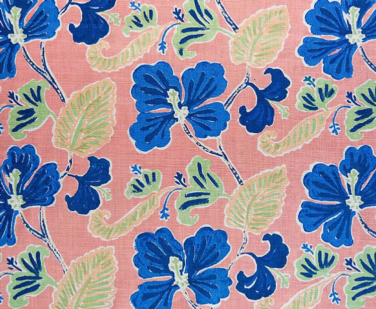 Detail of fabric in a flower and leaf print in shades of navy and green on a pink field.