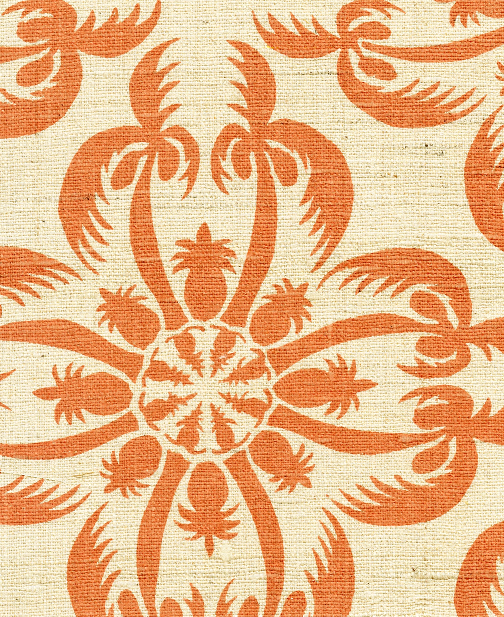 Detail of fabric in a playful botanical print in orange on a cream field.