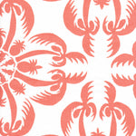 Detail of fabric in a playful botanical print in coral on a white field.