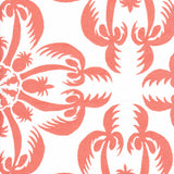 Detail of fabric in a playful botanical print in coral on a white field.