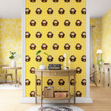 A maximalist living space with an accent wall papered in a repeating lion face pattern in tan, brown and yellow.