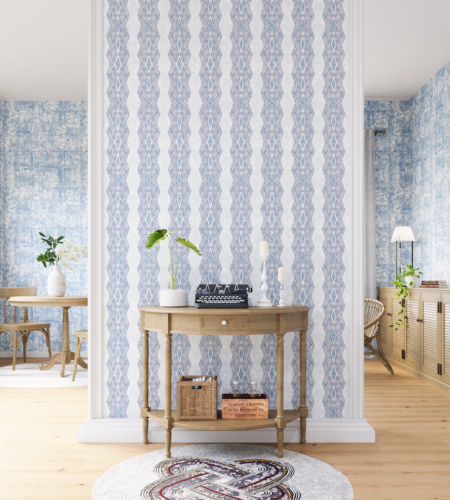 A maximalist living space with an accent wall papered in an intricate diamond stripe print in blue and cream.