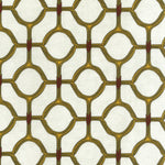 Detail of fabric in a rounded lattice print in yellow and red on a mottled cream field.