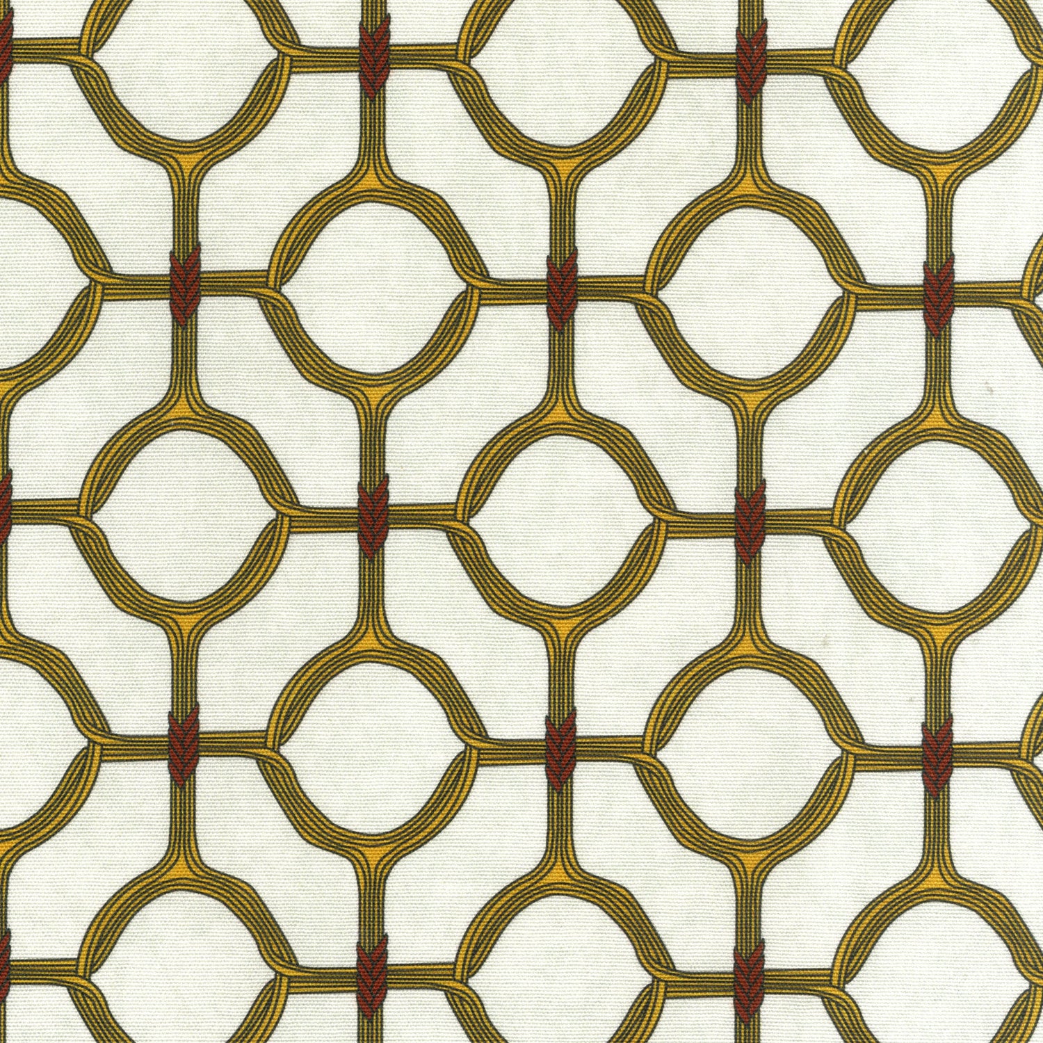 Detail of fabric in a rounded lattice print in yellow and red on a mottled cream field.