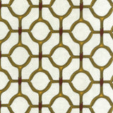 Detail of fabric in a rounded lattice print in yellow and red on a mottled cream field.