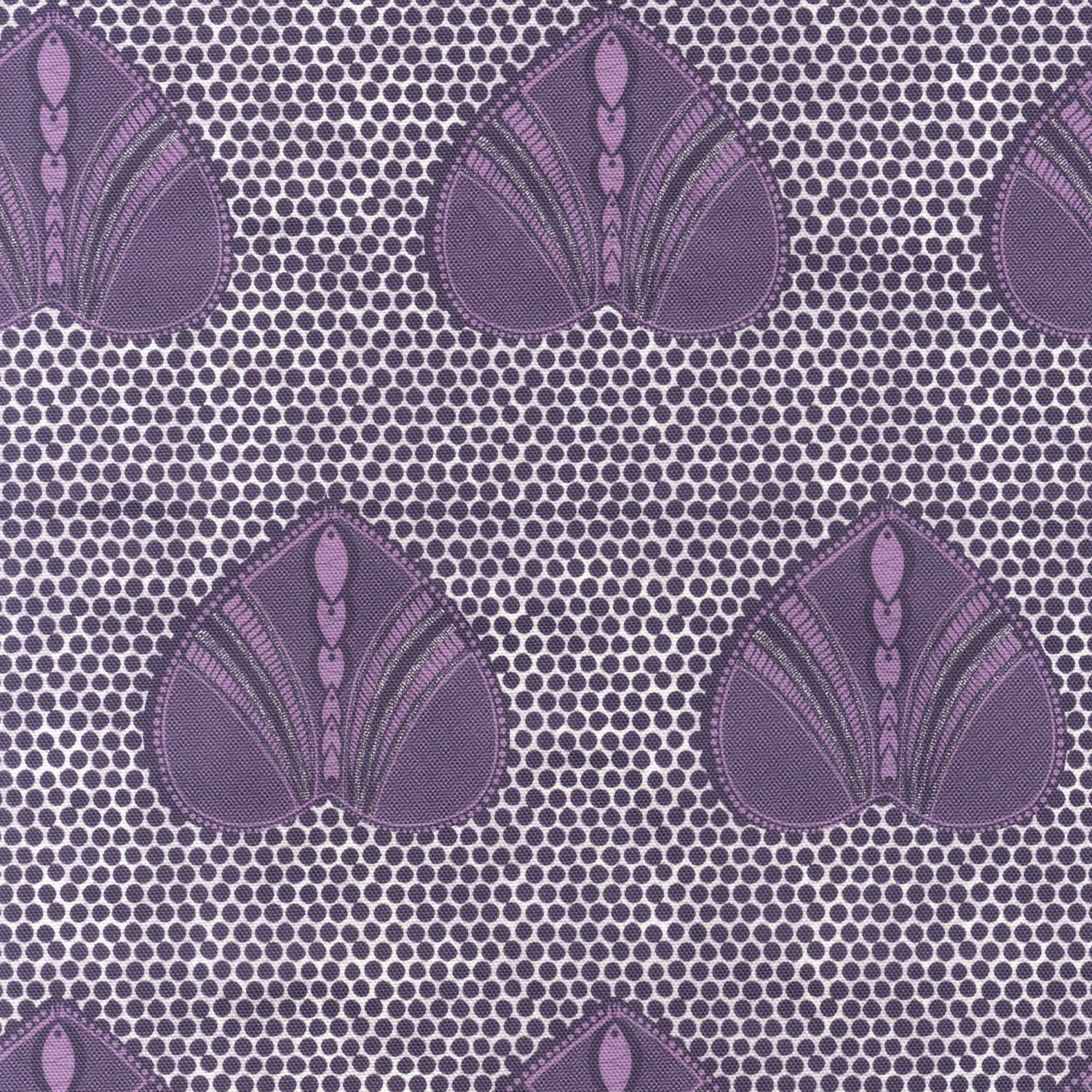Detail of fabric in a geometric heart print in purple and black on a light purple field.