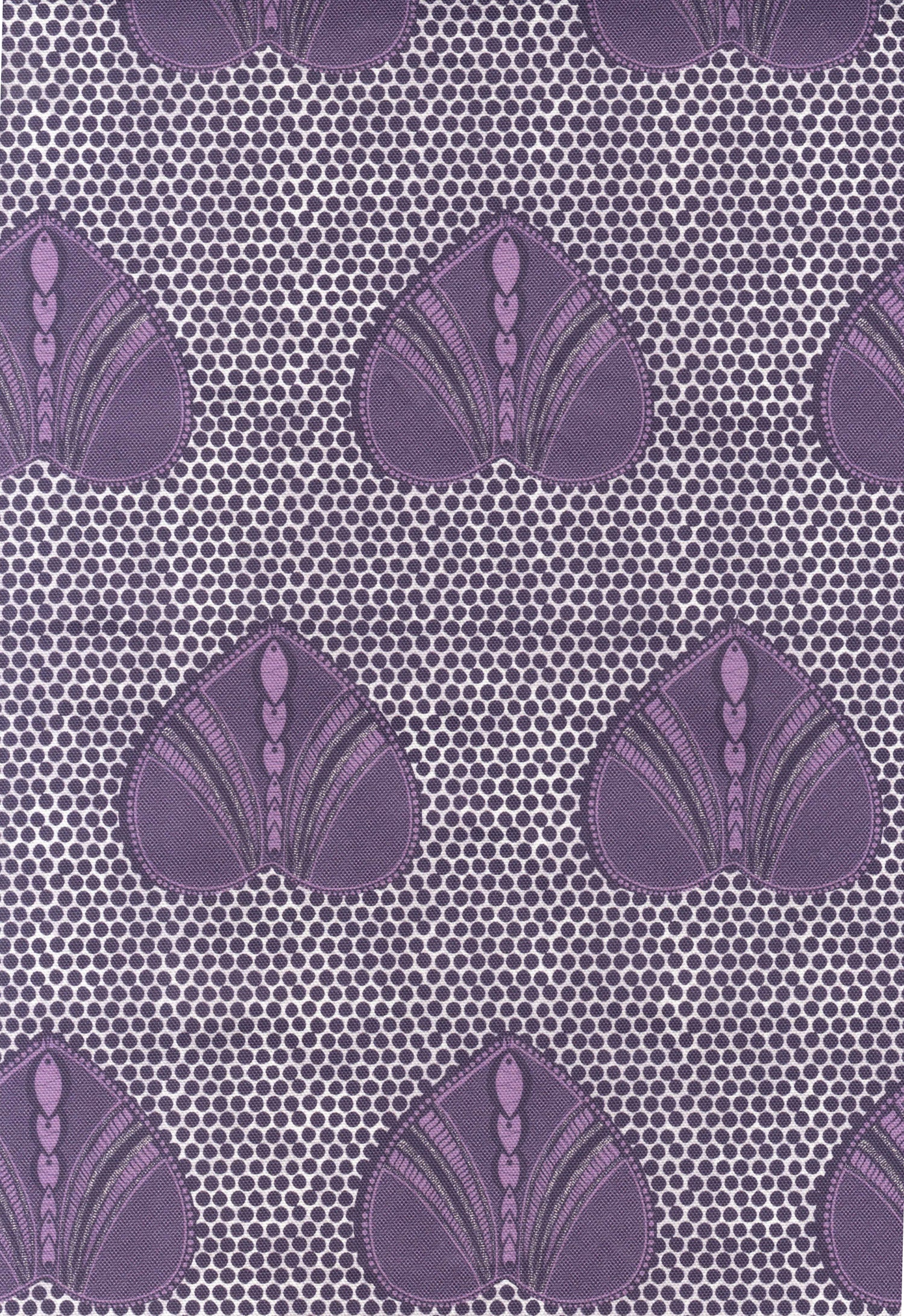 Detail of fabric in a geometric heart print in purple and black on a light purple field.