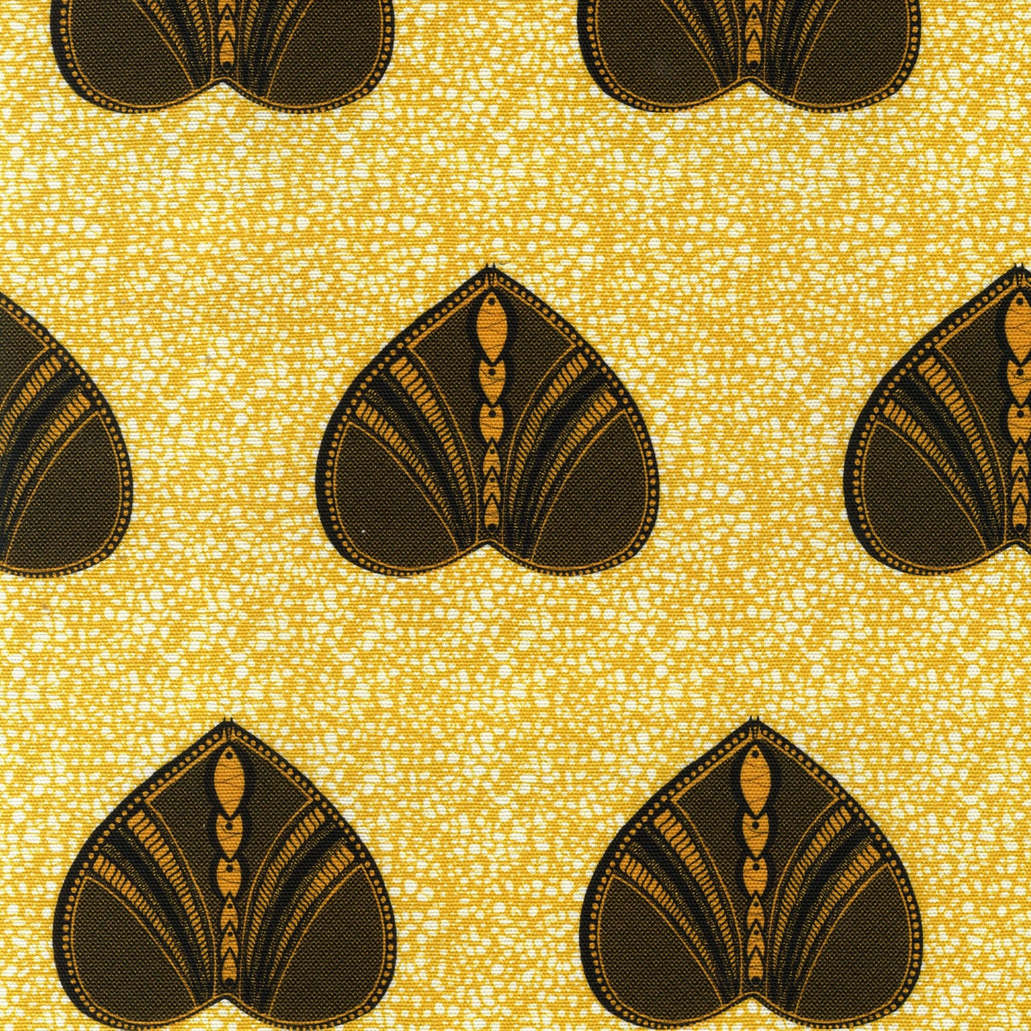 Detail of fabric in a geometric heart print in yellow and black on a yellow field.