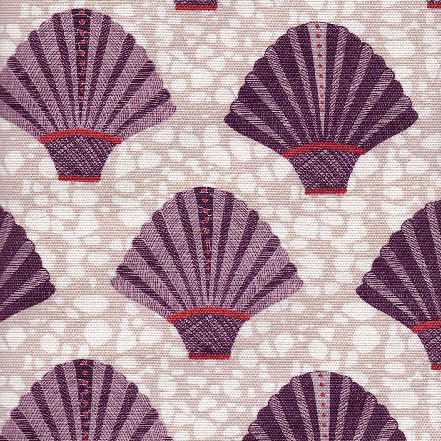 Detail of fabric in a playful fan print in purple and red on a mottled cream field.