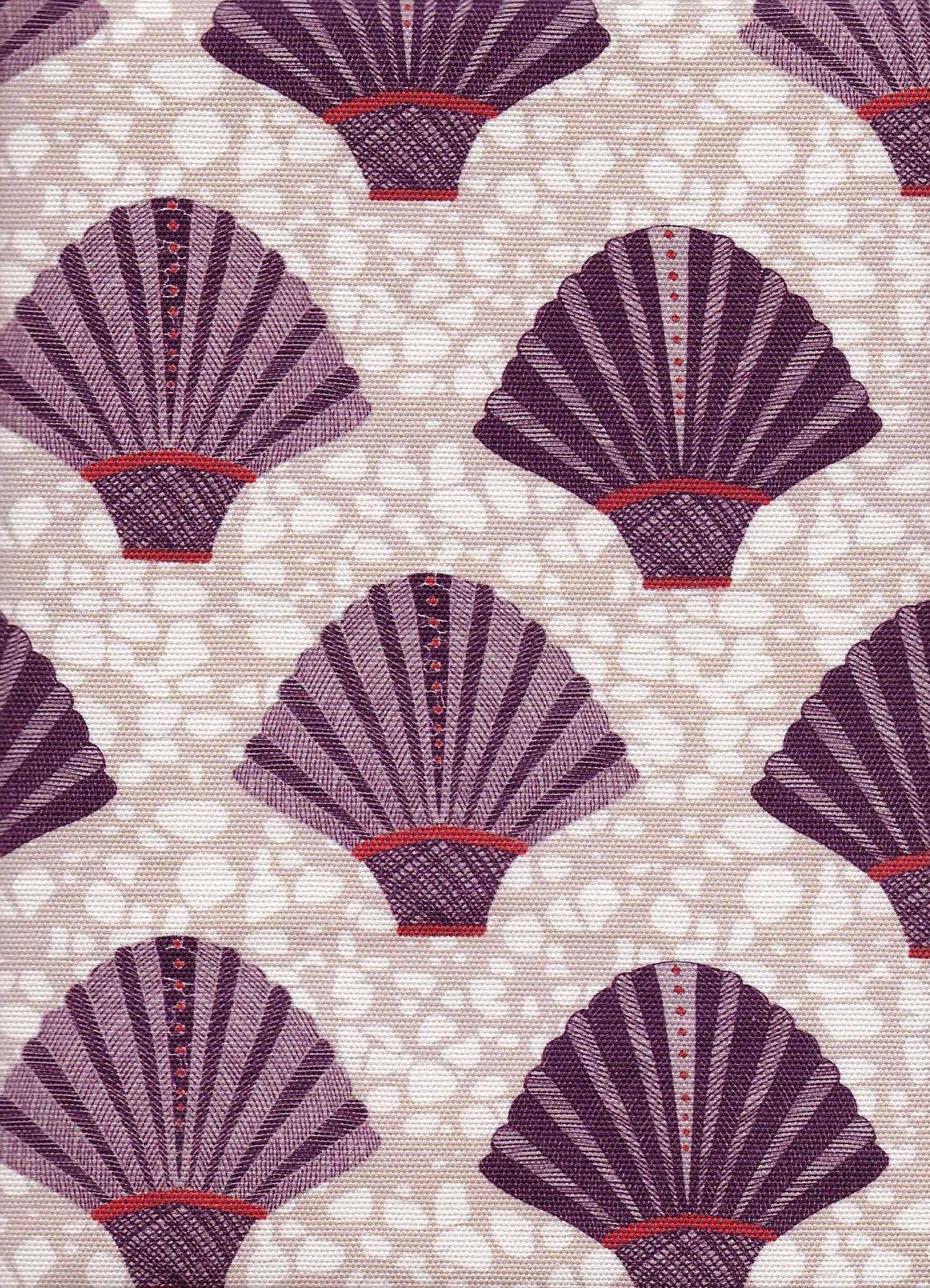 Detail of fabric in a playful fan print in purple and red on a mottled cream field.