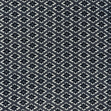 printed cotton fabric in a gridded star pattern in indigo on a white field.