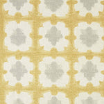 Detail of fabric in a dyed grid print in yellow and gray on a cream field.