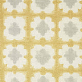 Detail of fabric in a dyed grid print in yellow and gray on a cream field.