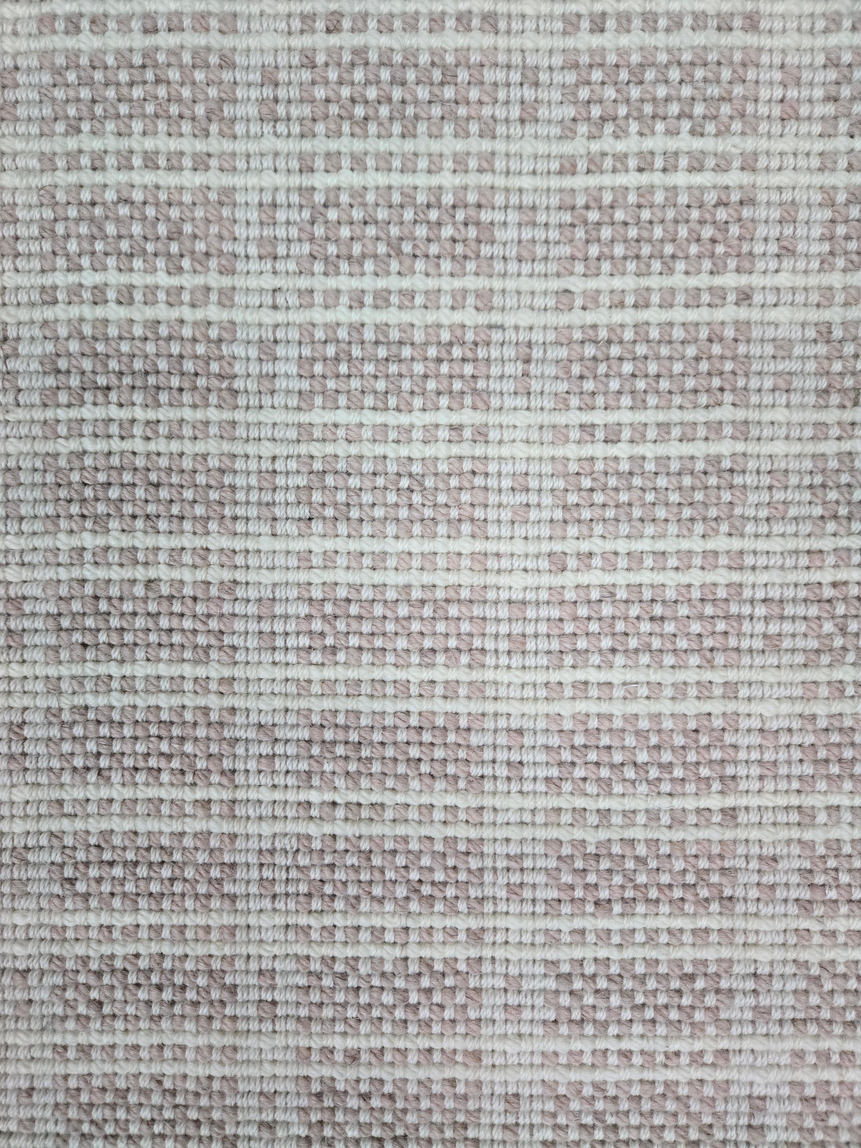 Broadloom carpet in slim plaid pattern in cream and pale pink