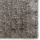 Detail of a hand-painted wallpaper swatch with an undulating ribbon pattern in charcoal on a silver field.