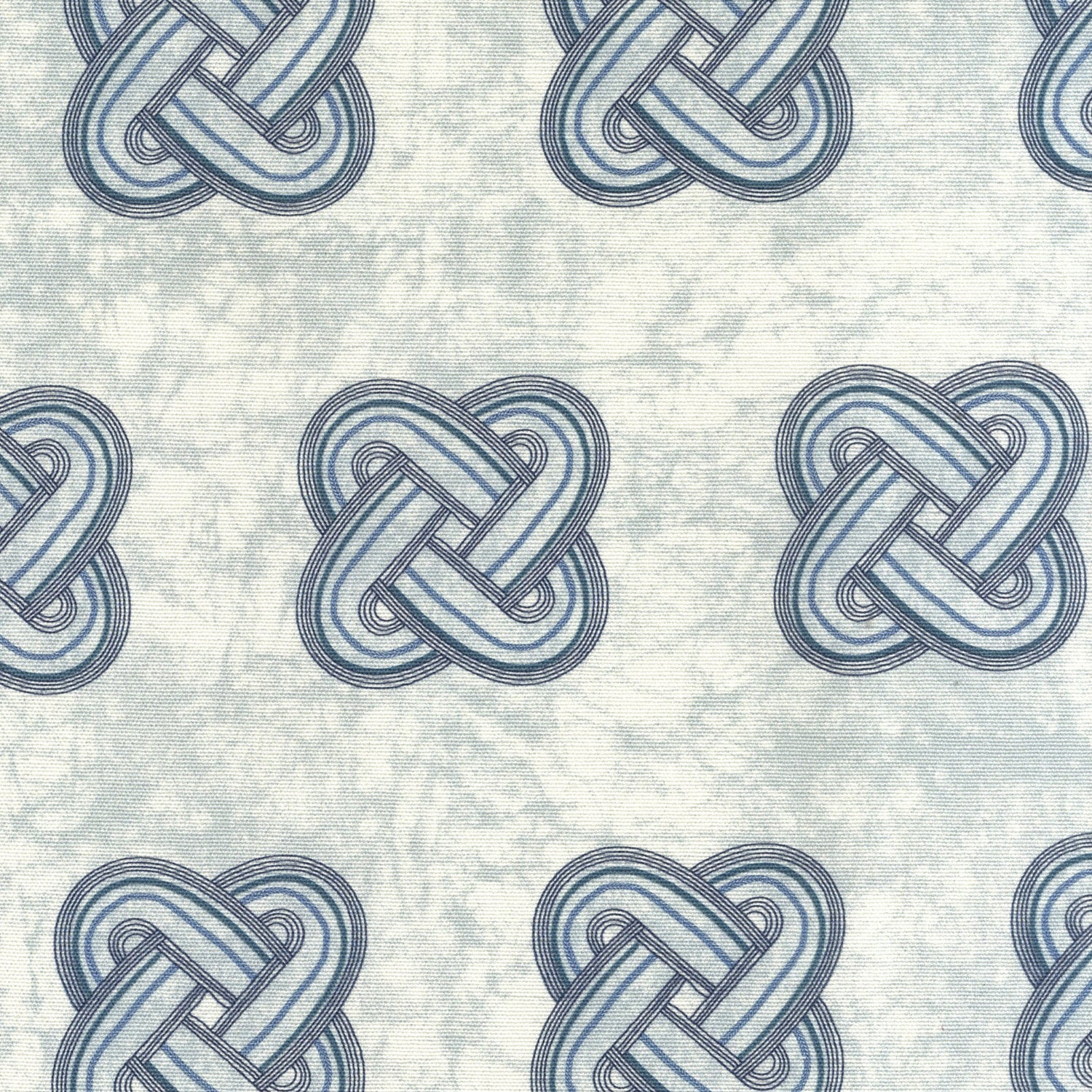 Detail of fabric in a repeating knot print in gray and navy on a light gray field.