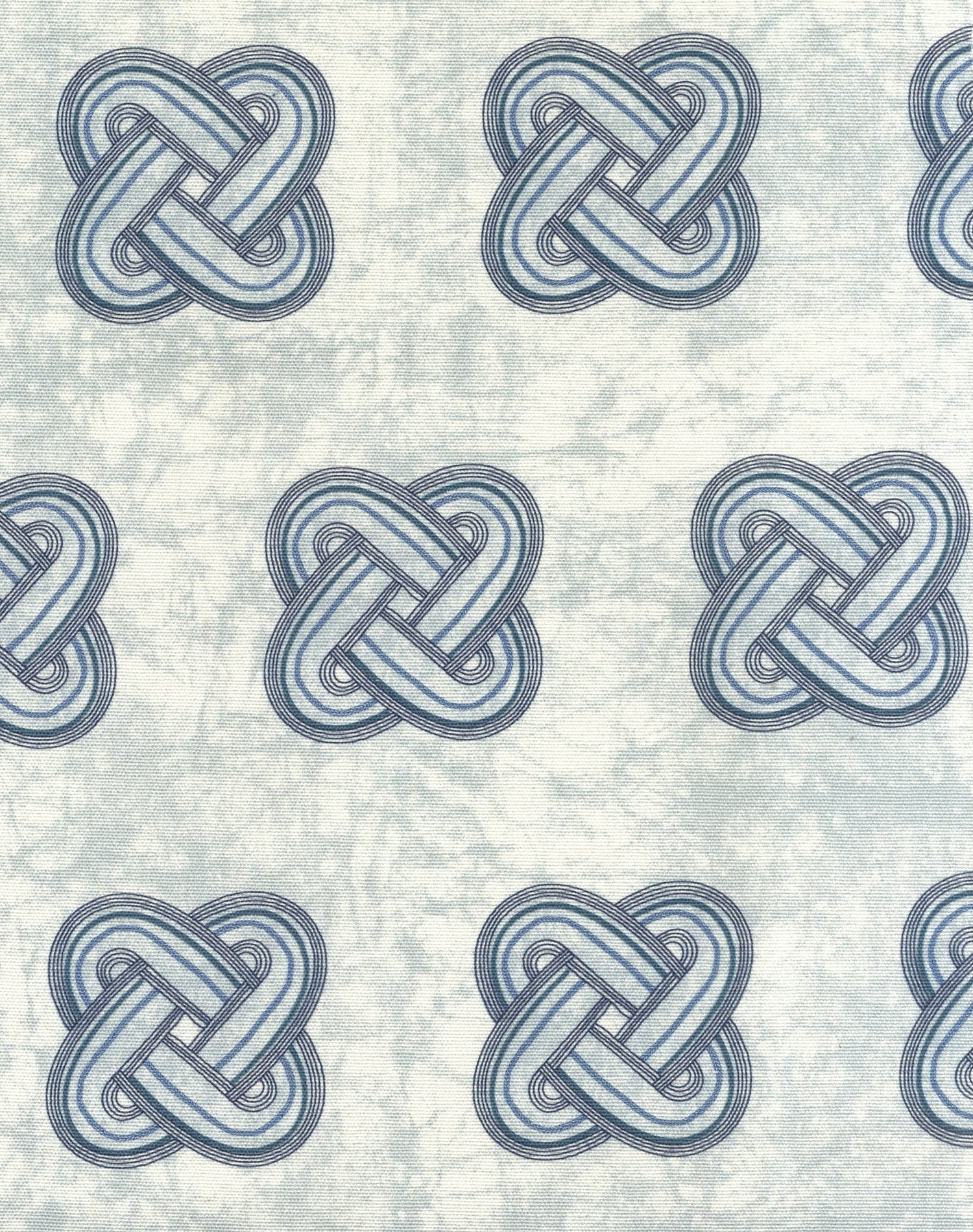 Detail of fabric in a repeating knot print in gray and navy on a light gray field.