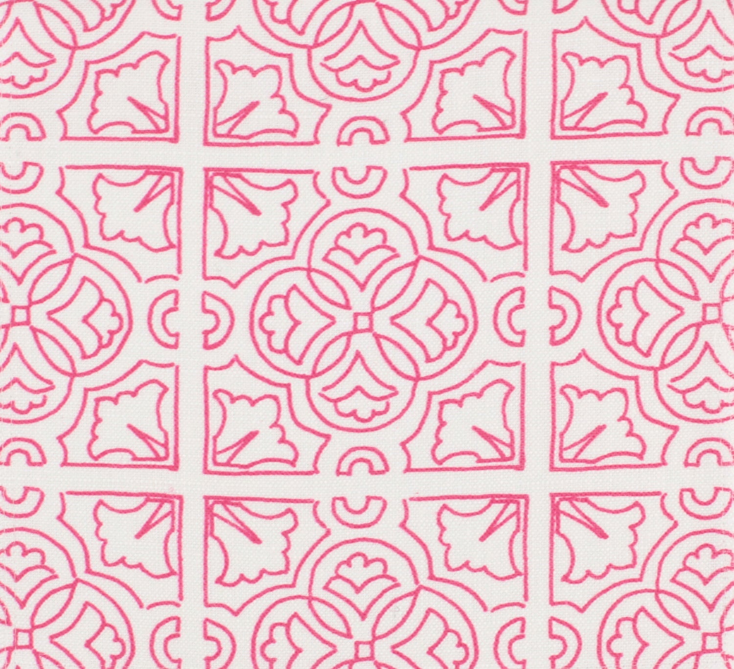 Detail of fabric in a damask lattice print in magenta on a white field.