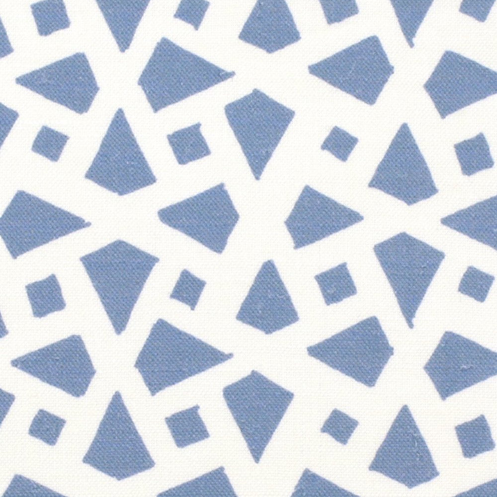 Detail of fabric in a geometric lattice print in blue on a white field.