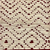 Handknotted Moroccan style rug with a raised ivory cut pile motif. 