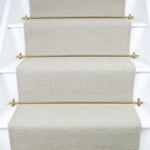 Diamond geometric flatweave runner in neutral on white staircase